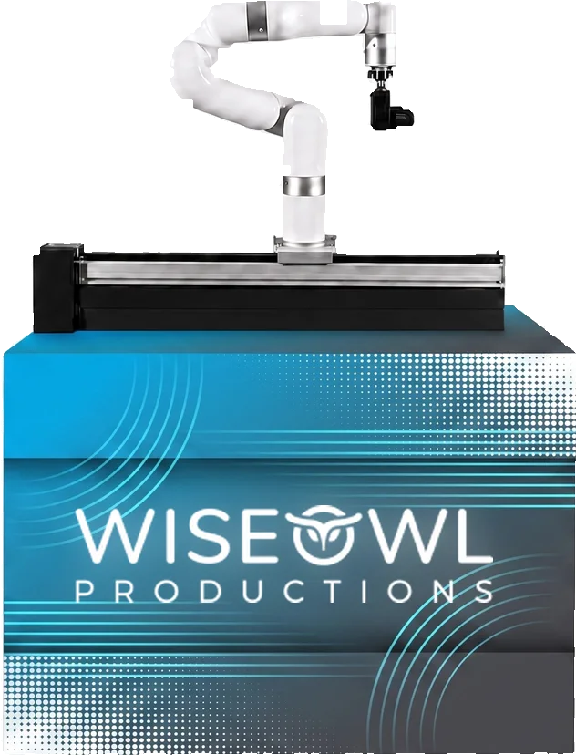 Robotic camera arm mounted on a rail atop a branded base cabinet, shown in a Wise Owl Productions custom wrap